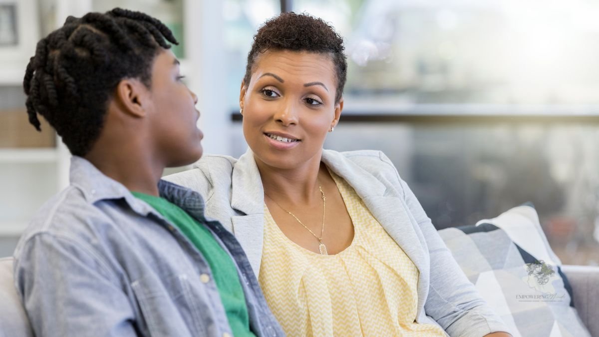 Teenager talking with a supportive adult about school difficulties